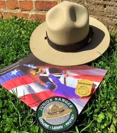 Junior Ranger booklet, badge, patch, and park ranger hat.