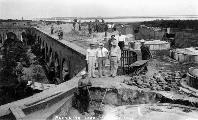 Members of the PWA and CCC Camp 460 repairing the lead roof on the east corner of Fort Pulaski.