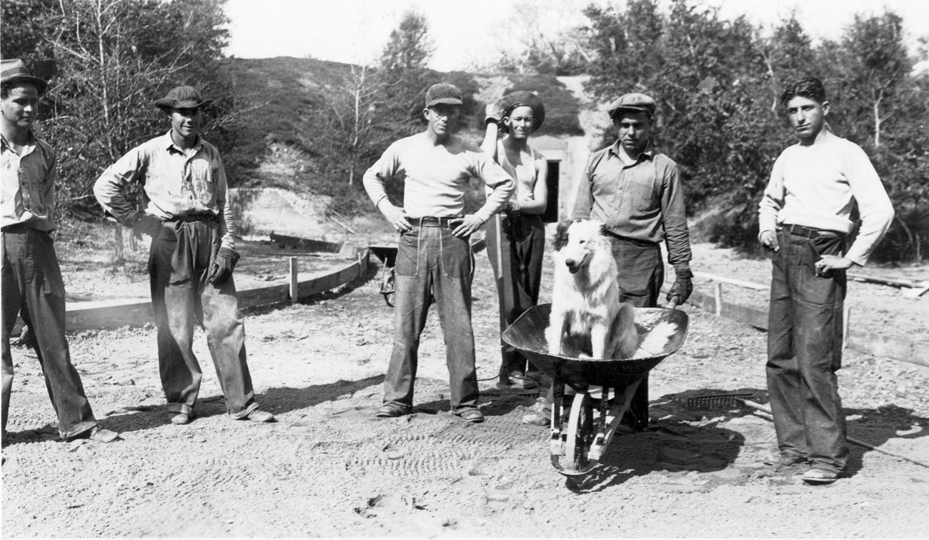 CCC Workers pose with Dog