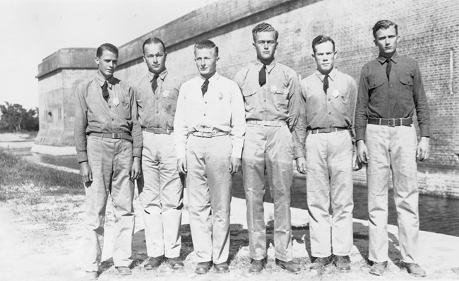 Men standing outside entrance to Fort Pulaski