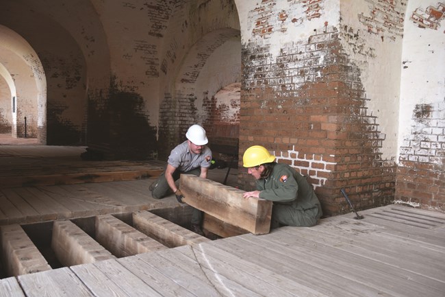 Workers fixing floor at Fort Pulaski