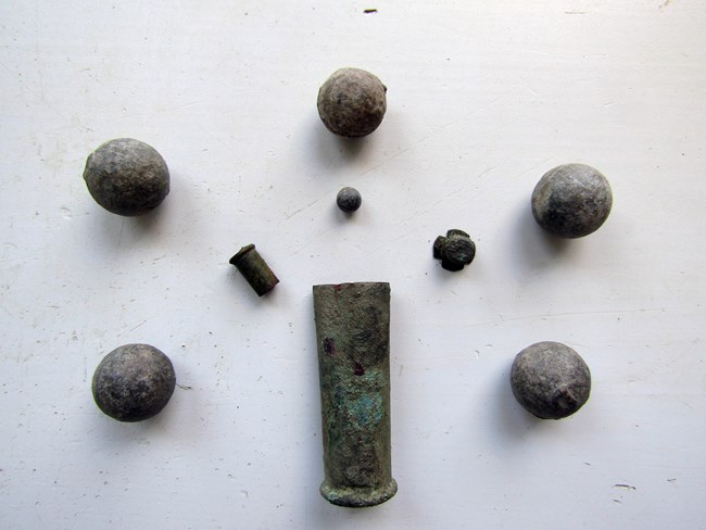 different shapes and sizes of gun ammunition found throughout the site.