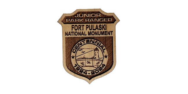 Wooden Junior Ranger badge for Fort Pulaski National Monument.