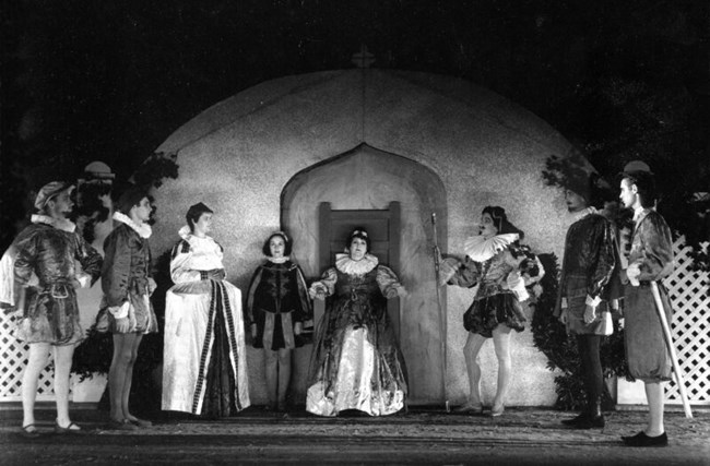 Black and white photograph of the Queen's Chamber set and actors in 1937