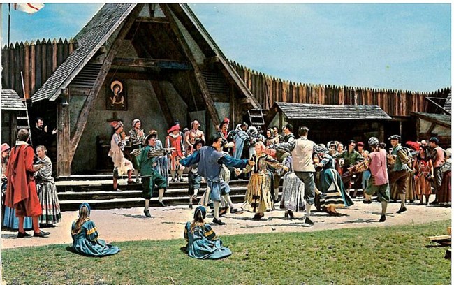 People in 1580s clothing dance in the Waterside Theatre