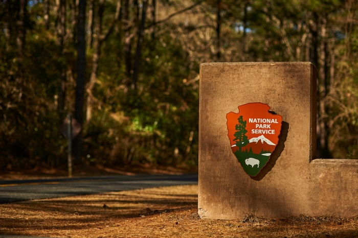 Image from 2021 of a National Park Service Arrowhead on entrance to Fort Raleigh NHS.