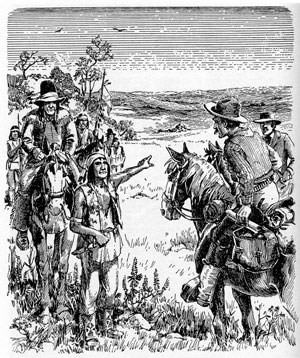 men dressed as native Americans talking to men on horses