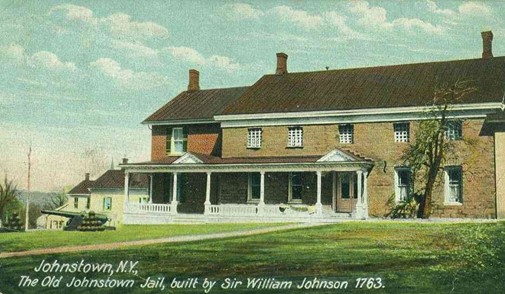The original Tryon County jail built by Sir William Johnson. The 1763 date on the image is incorrect, as Tryon County was not created until 1772. It is made of cut stone with a brick chimney on each end of the building. 