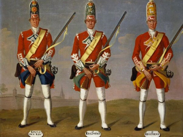 An old painting of 3 tall soldiers with slightly different uniforms, wearing tall caps, and holding a muskets in front of them.