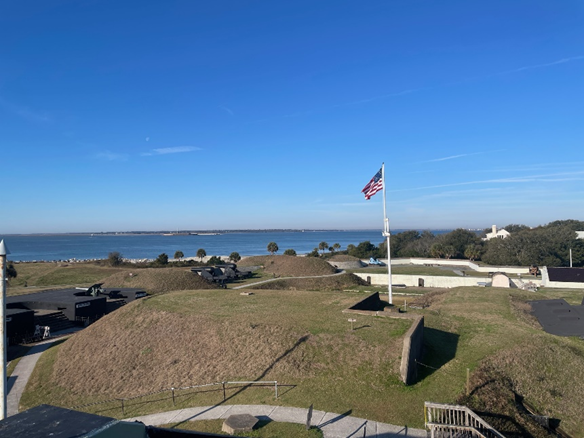 35-star flag flies over Fort Moultrie with Charleston Harbor in the background