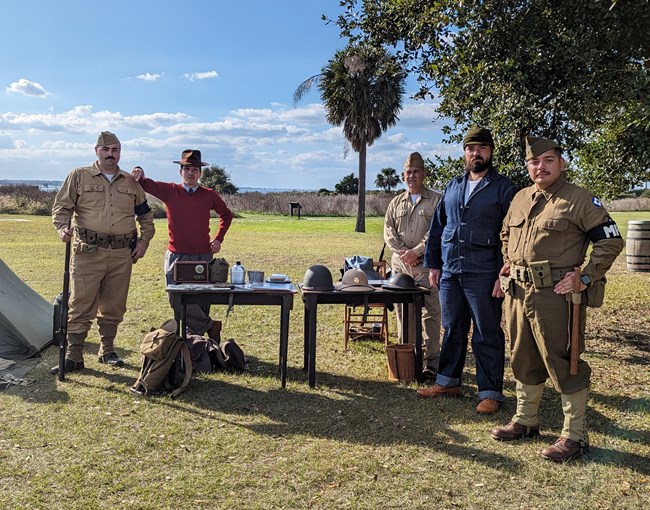 A group of World War II living historians pose for the camera