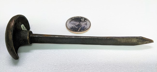 Civil War-era fuze cutter, which looks like a large thumbtack