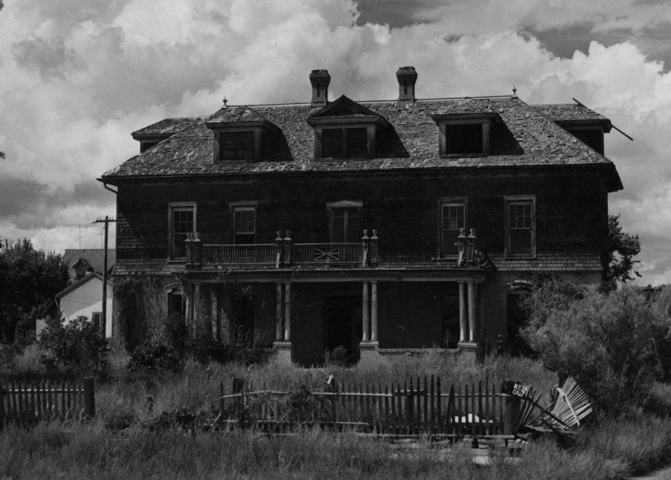 large, abandoned house with missing windows