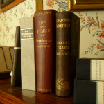 Three books on a desk