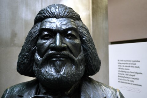 A close-up of a statue of Frederick Douglass focusing on his face