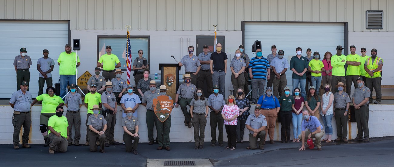 A staff photo with about 50 park service employees outside.