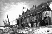 Historic photo of the riverfront store and saloon at Bergman, Alaska in the winter of 1899.
