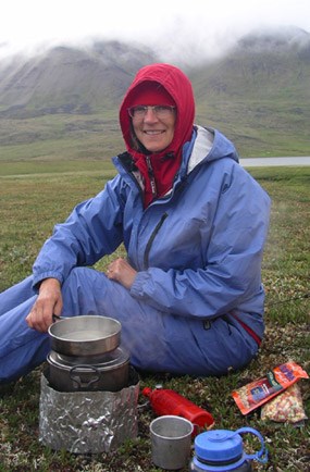 Cooking on a small stove on a cold July evening in the Brooks Range.