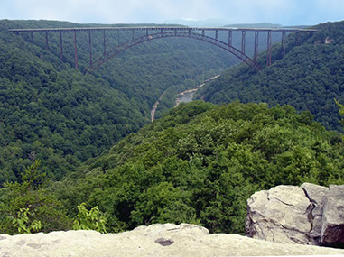 bridge spanning deep river gorge