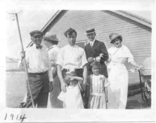 a family in nice attire stand together