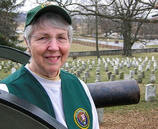 A park volunteer stands ready to help visitors in the Soldiers' National Cemetery.