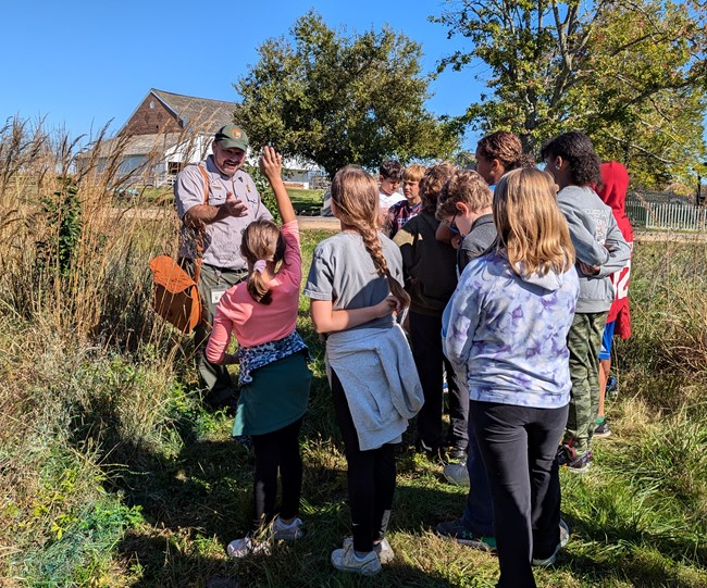 A Ranger talks to a school group