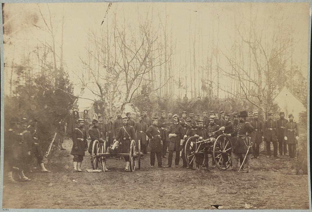 U.S. Civil War officers of the 96th Pennsylvania Infantry gather around two unusual pieces of Civil War artillery