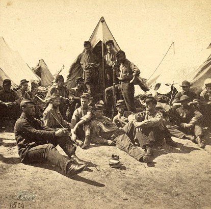 Several Civil War Soldiers Lounge around in camp