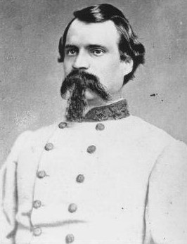 Black and white imange of a bearded man in a gray coat