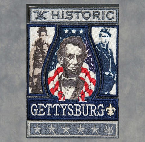 The Gettysburg scout badge has a picture of Abraham Lincoln and a Union and a Confederate soldier.