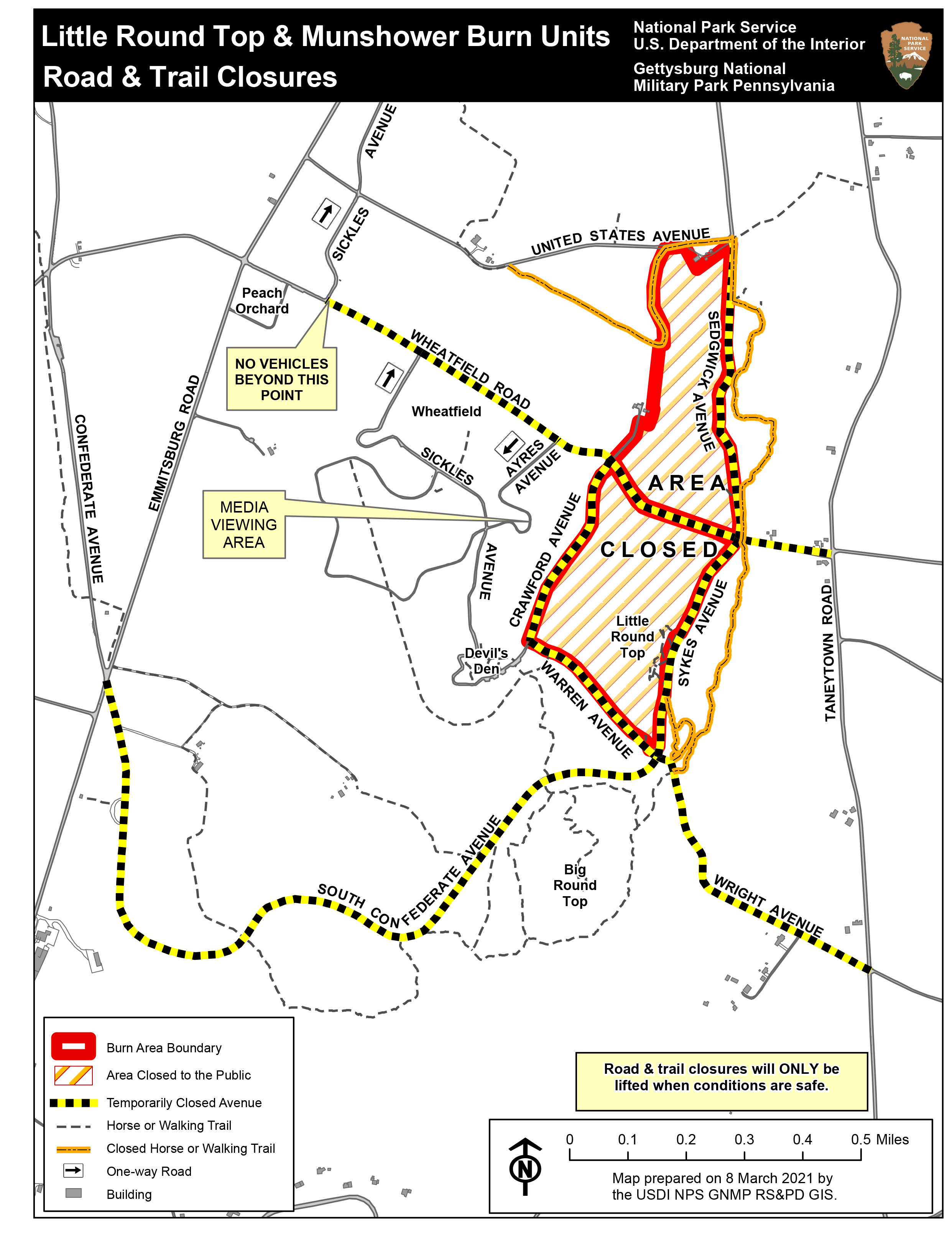 A map of the Little Round Top and Munshower Field prescribed fire closure area. Roads have yellow and black hashes denoting closures. Area closures are marked with orange and black stripes and a red outline.