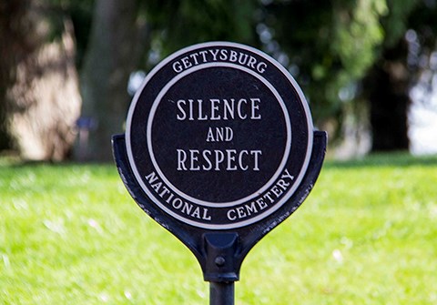 There are signs at the entrances to the cemetery that read Silence and Respect.
