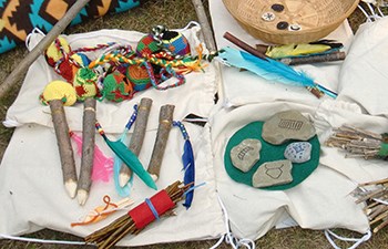 Assortment of American Indian inspired toys and sticks