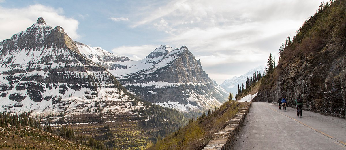 Bikers riding the Going-to-the-Sun Road past Weeping Wall