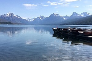 Mountain range, lake, aluminum boats on dock