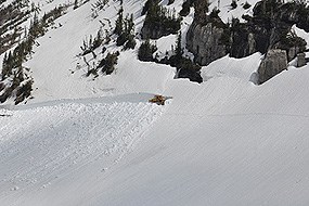 snow plow cuts through enormous drift