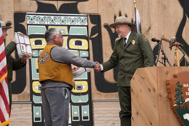 Leaders of Glacier Bay National Park and the Hoonah Indian Association shaking hands