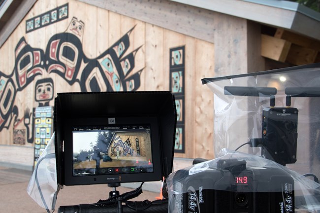 Video camera focusing on the tribal house