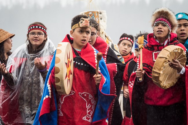 Tlingit youth in song wearing regalia.