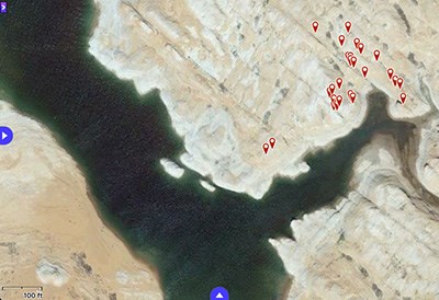 Satellite view of Lake Powell, with many red marker points