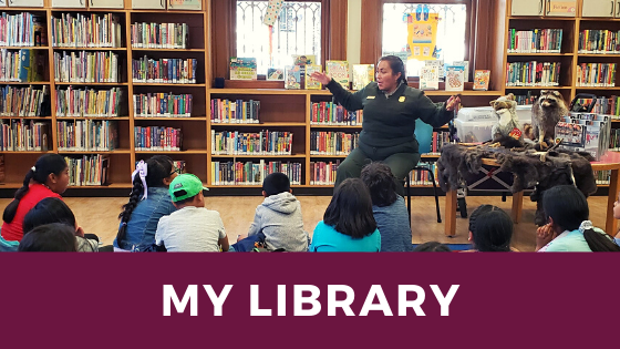 Ranger Fatima at Mission Branch Library telling a story in 2019.