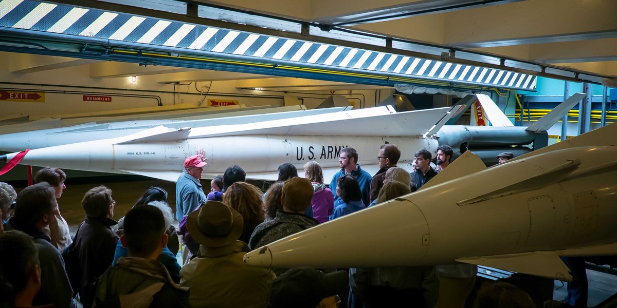 volunteer leads visitors through nike missile museum