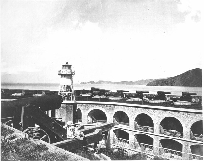 An empty fort with a line of Columbiad guns pointing towards the Golden Gate