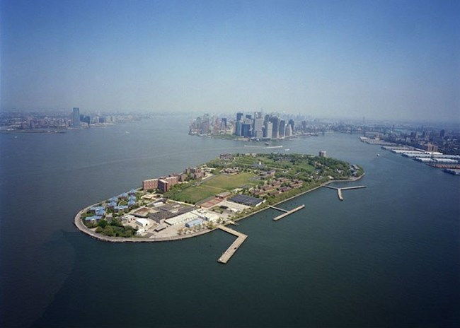 Aerial of Governors Island with Manhattan in the center background and Brooklyn on the right