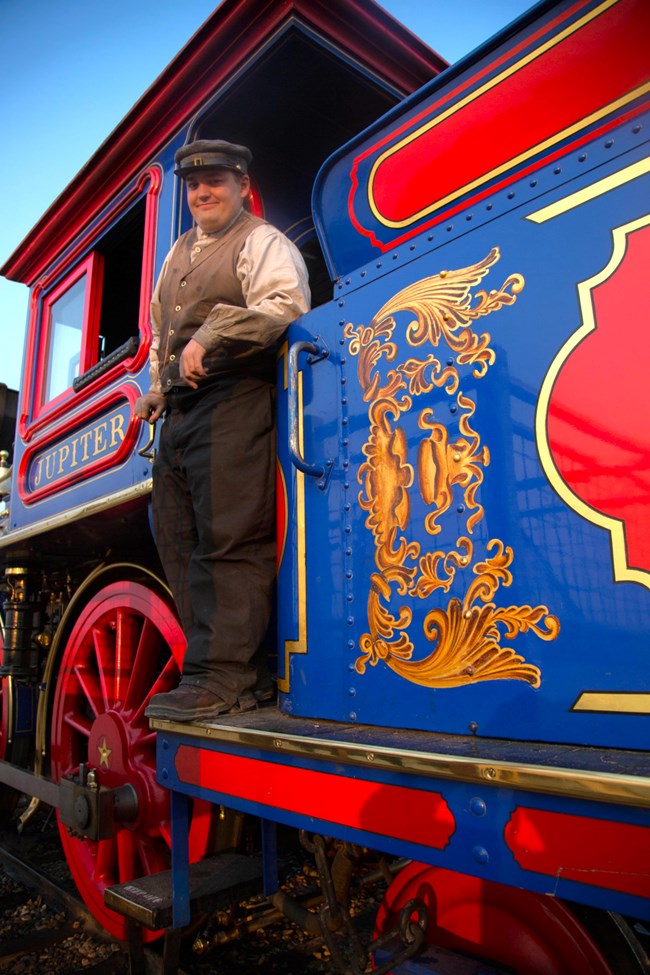 Conductor standing on Locomotive