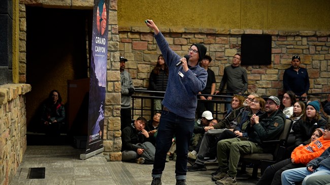 Man giving presentation in a theater