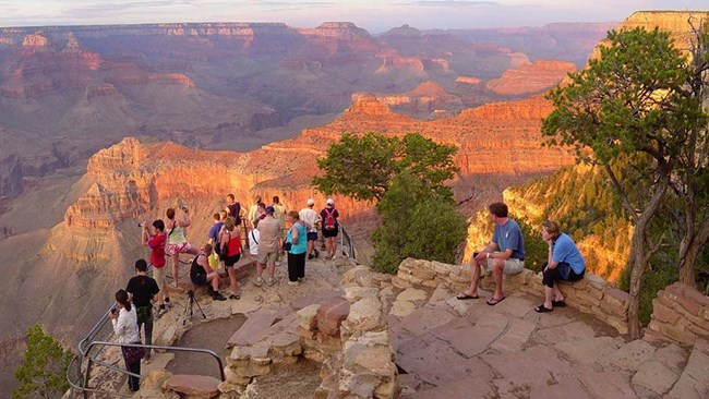 Visitors gather at the Grand Canyon's rim to admire the view.