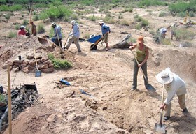 Archeologists backfilling the kiva.