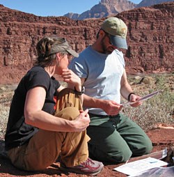 2 archeologists working at the Unkar Delta Site.