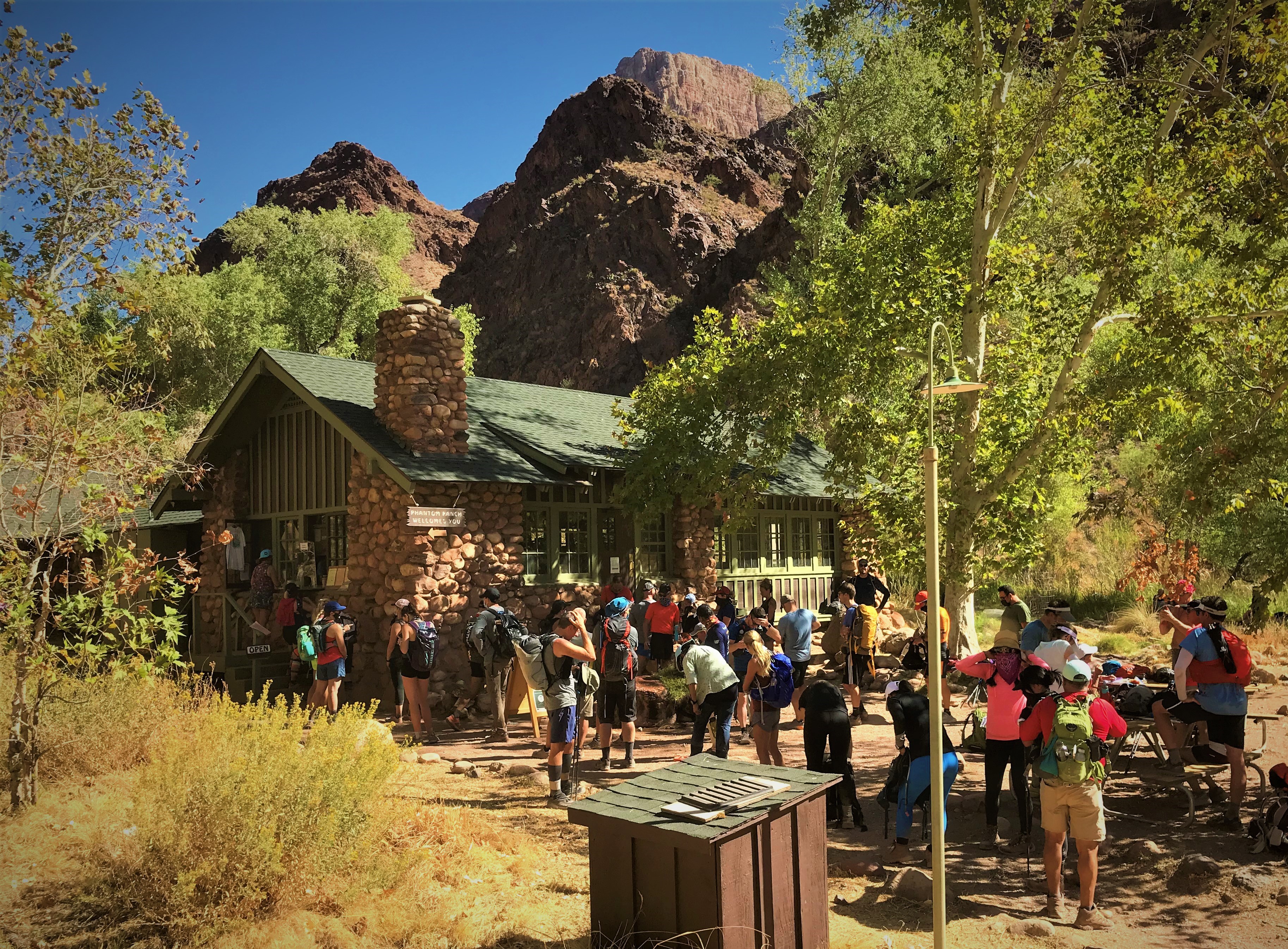Visitors gather around the Phantom Ranch Canteen at the bottom of Grand Canyon
